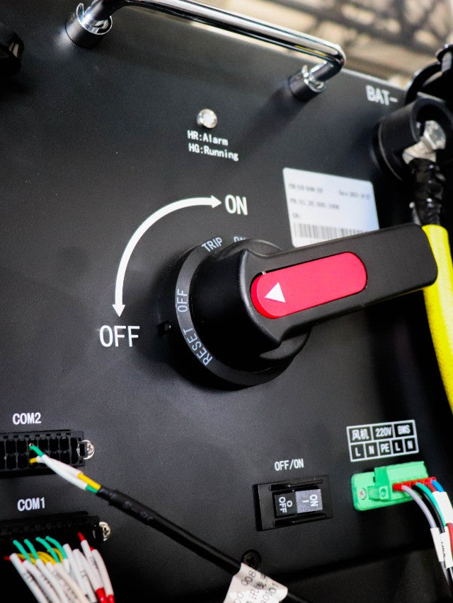 Detailed view of the control switch on an I-G3N battery system, highlighting the ON/OFF switch, connectivity ports, and operational indicators for secure and efficient energy management.
